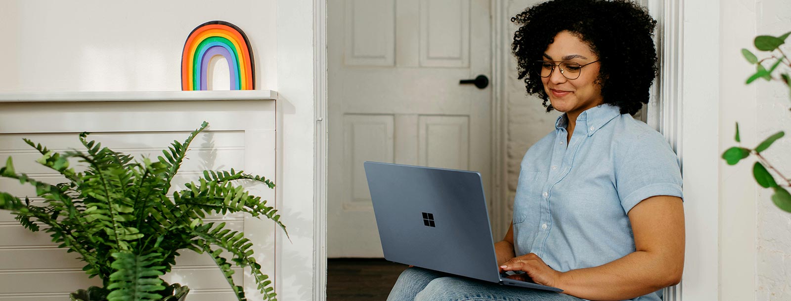Woman using laptop at home